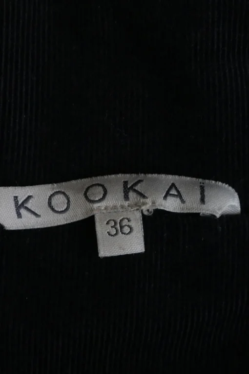Black cotton twill high collar safari-style chore jacket with cropped sleeves