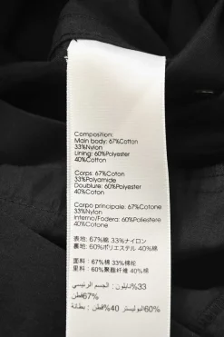 Black cotton-blend satin point collar half-button slip-on coverall jumpsuit with pull tab belt at waist