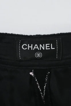Black cotton-blend stripe jacquard pleat-front tailored shorts with Coco Mark shank button and fly front fastening
