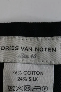 Black cotton-silk blend high-rise apron trousers with ribbon tie at waist with slanted hip pockets
