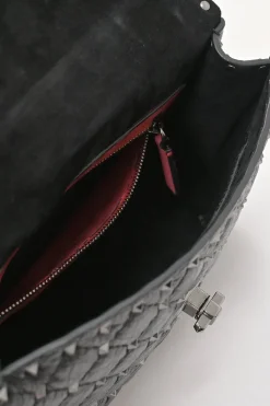 Black crinkle leather Rockstud spike crossbody flap bag with gunmetal hardware