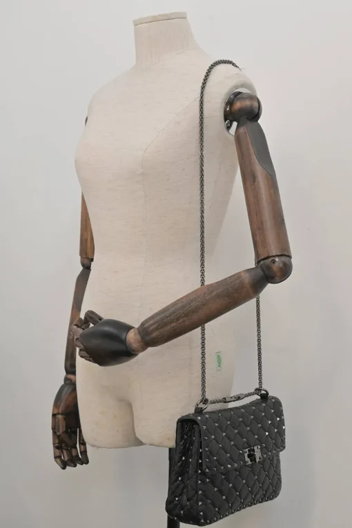 Black crinkle leather Rockstud spike crossbody flap bag with gunmetal hardware