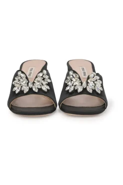 Black crystal-embellished satin and leather block heel mules with curved V-neck vamp