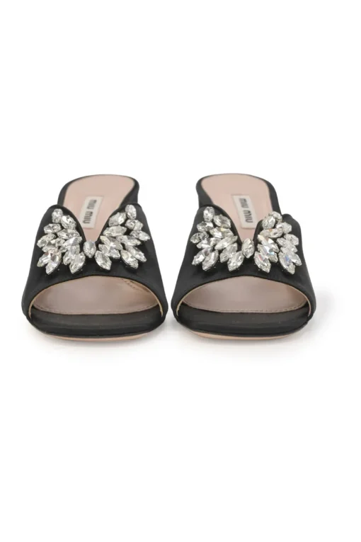 Black crystal-embellished satin and leather block heel mules with curved V-neck vamp