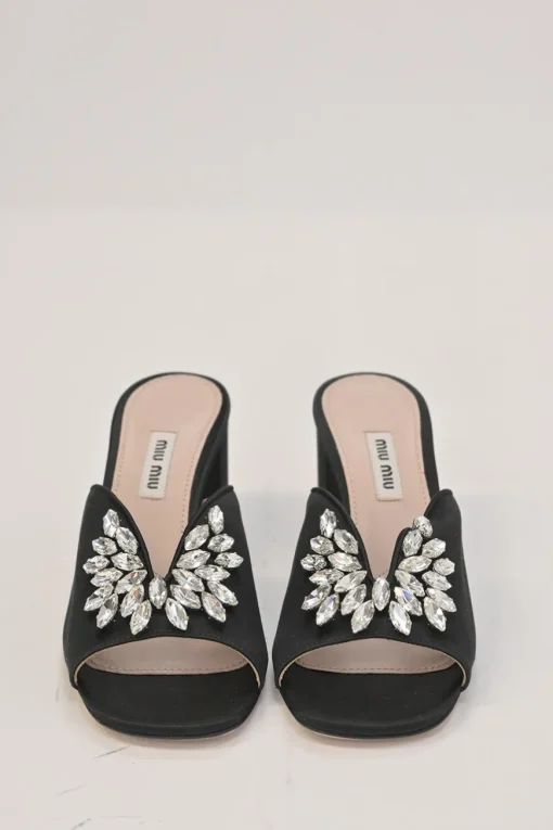 Black crystal-embellished satin and leather block heel mules with curved V-neck vamp