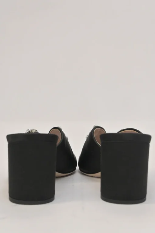 Black crystal-embellished satin and leather block heel mules with curved V-neck vamp