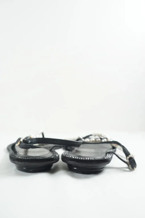 Black faux-pearl embellished leather thong sandals with adjustable buckle ankle strap