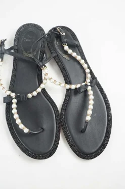 Black faux-pearl embellished leather thong sandals with adjustable buckle ankle strap