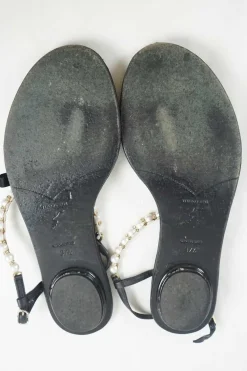 Black faux-pearl embellished leather thong sandals with adjustable buckle ankle strap