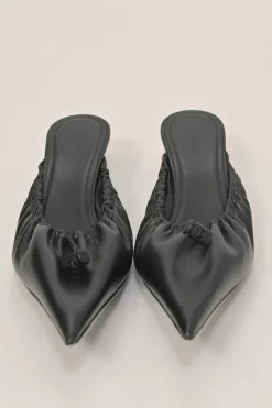 Black gathered supple lambskin pointed-toe Scrunch Knife mules with toggle vamps and comma heels