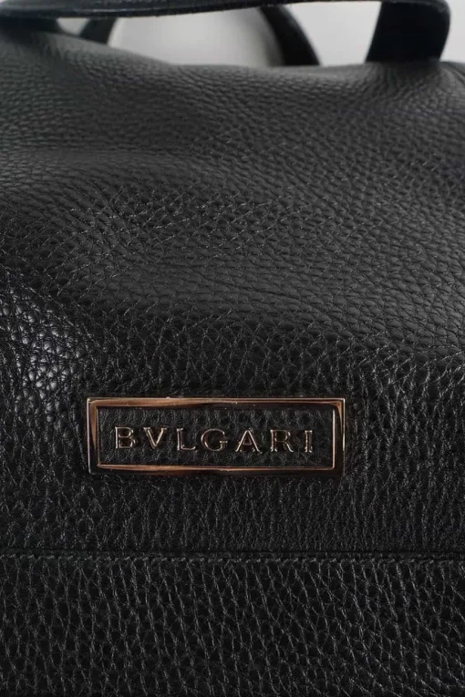 Black grained calf twin handle tote bag with top zip opening.