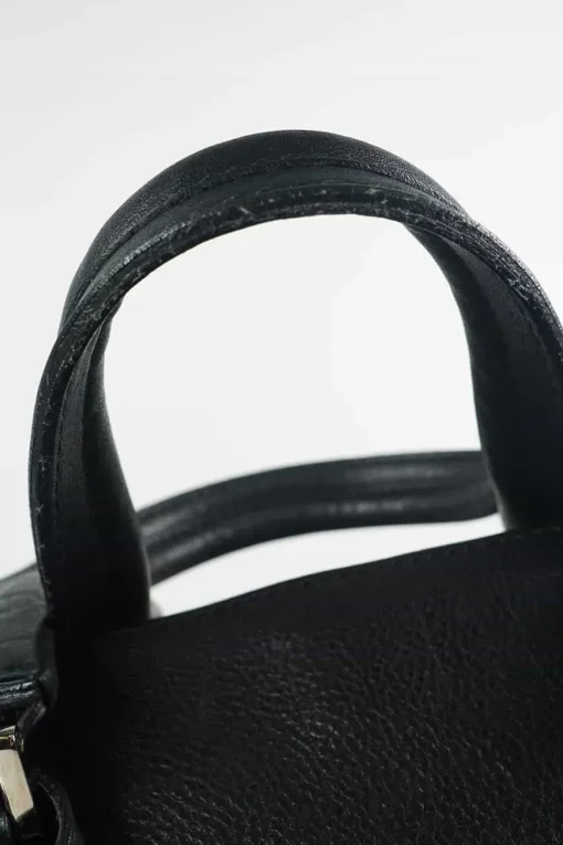 Black grained calf twin handle tote bag with top zip opening.