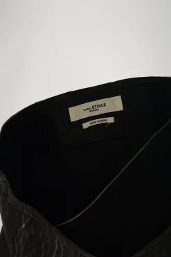 Black lambskin leather wrap-front biker mini skirt with fixed buckle belt fastening at side