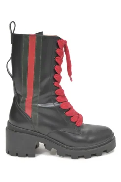 Black leather and rubber Trip pull-on mid-calf platform combat boots with webbing trim detailing and tread soles