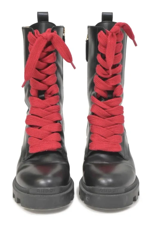 Black leather and rubber Trip pull-on mid-calf platform combat boots with webbing trim detailing and tread soles