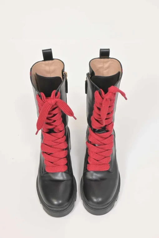 Black leather and rubber Trip pull-on mid-calf platform combat boots with webbing trim detailing and tread soles