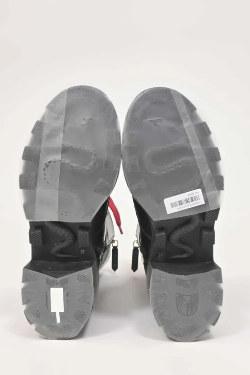 Black leather and rubber Trip pull-on mid-calf platform combat boots with webbing trim detailing and tread soles