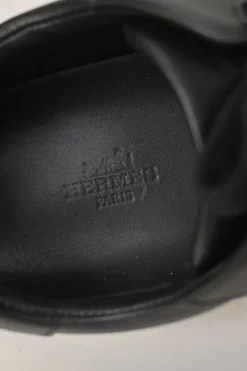Black leather and rubber low-top Day sneakers with palladium-plated Kelly buckle mid-arch strap