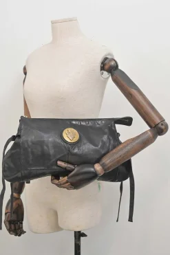 Black leather Hystetria zip pouch featuring gold-tone metallic medallion appliqué