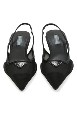 Black mesh, leather and rubber pointed-toe slingback kitten-heel pumps with metallic enamel logo vamp plaque
