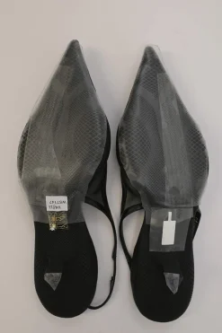 Black mesh, leather and rubber pointed-toe slingback kitten-heel pumps with metallic enamel logo vamp plaque