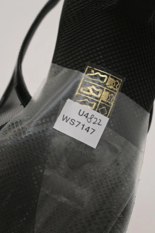 Black mesh, leather and rubber pointed-toe slingback kitten-heel pumps with metallic enamel logo vamp plaque