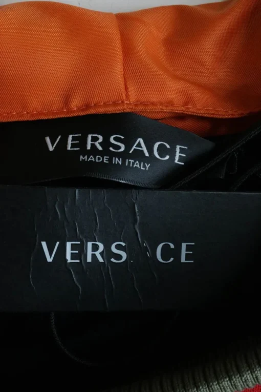 Black mixed media cotton-blend paneled logo hoodie with contrasting ripstop toggle hood in orange