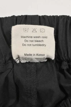 Black organic cotton poplin Lui two-piece lounge set featuring spread collar shirt and pull-on wide-leg shorts