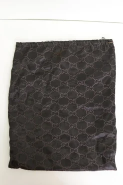 Black paneled fabric and leather lace-up mid-calf boots with rubber soles and webbing details