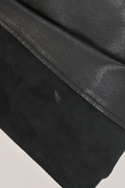 Black paneled leather and suede pull-on high-rise skinny pants with slanted hip welt pockets