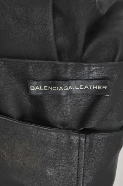 Black paneled leather and suede pull-on high-rise skinny pants with slanted hip welt pockets