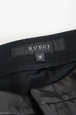 Black paneled polyamide and leather mid-rise skinny tailored trousers