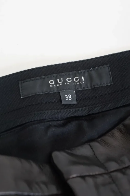 Black paneled polyamide and leather mid-rise skinny tailored trousers