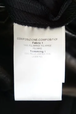 Black paneled polyamide and leather mid-rise skinny tailored trousers