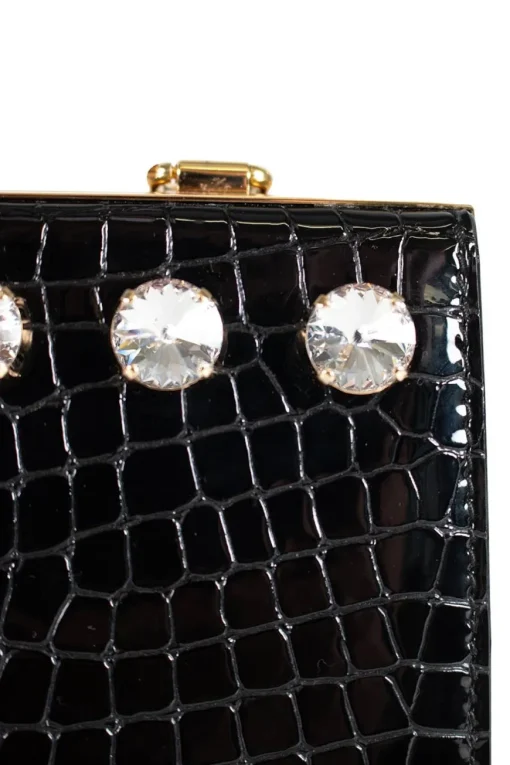 Black patent croc print  in a gold clasp frame bag, with round crystal embellishment and crystal clasp.