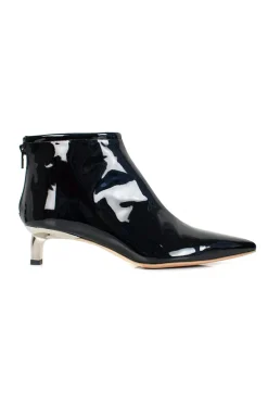 Black patent leather ankle boots with low silver heels.