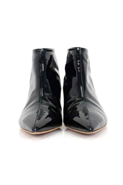 Black patent leather ankle boots with low silver heels.