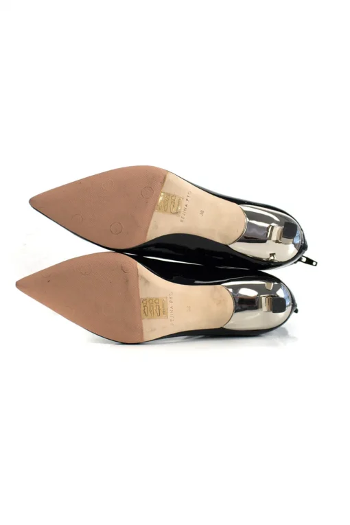 Black patent leather ankle boots with low silver heels.