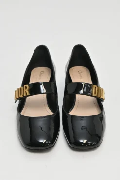 Black patent leather Baby D ballet Mary Jane pumps with logo plaque strap