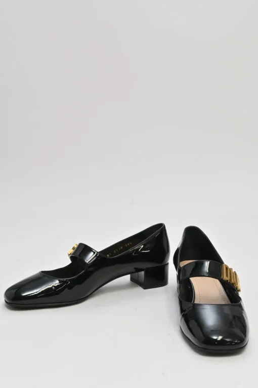 Black patent leather Baby D ballet Mary Jane pumps with logo plaque strap