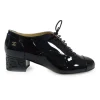 Black patent leather lace-up brogues with Coco Mark ankle plaque and sculpted camellia block heel