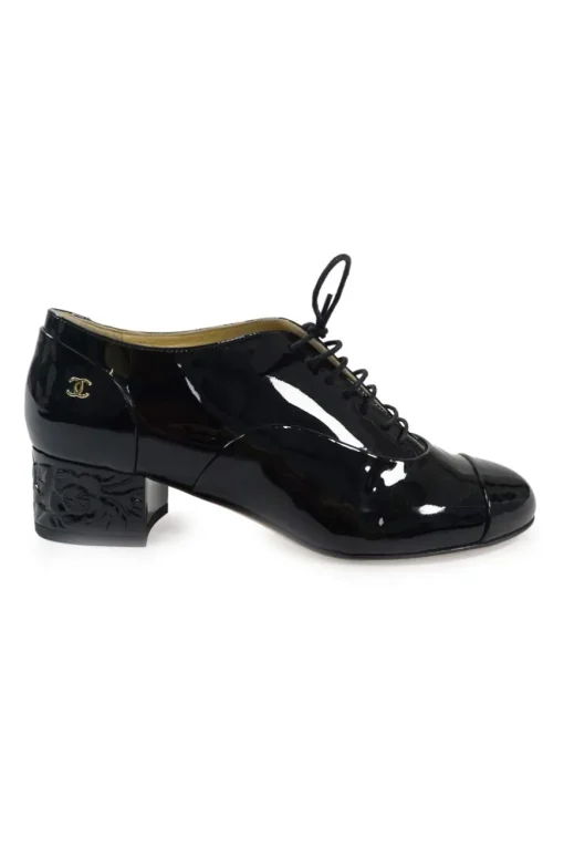 Black patent leather lace-up brogues with Coco Mark ankle plaque and sculpted camellia block heel