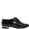 Black patent leather lace-up brogues with gold-tone metallic Coco Mark ankle and heel plaque