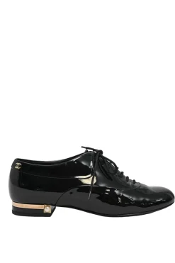 Black patent leather lace-up brogues with gold-tone metallic Coco Mark ankle and heel plaque