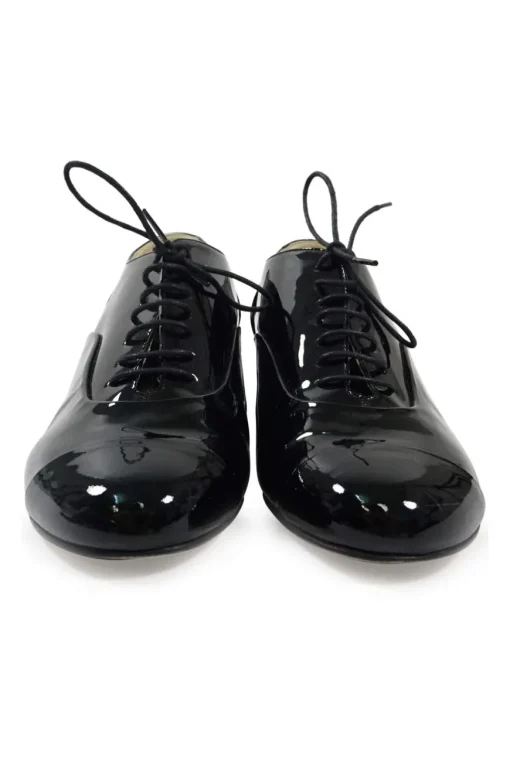 Black patent leather lace-up brogues with Coco Mark ankle plaque and sculpted camellia block heel