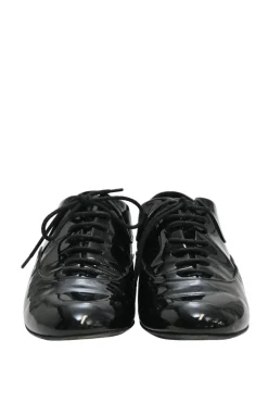 Black patent leather lace-up brogues with gold-tone metallic Coco Mark ankle and heel plaque