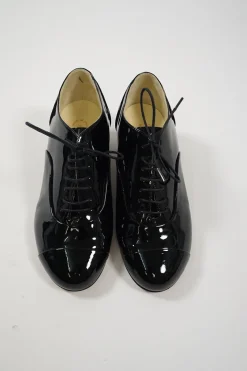 Black patent leather lace-up brogues with Coco Mark ankle plaque and sculpted camellia block heel