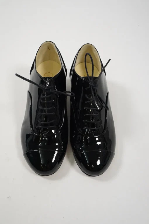 Black patent leather lace-up brogues with Coco Mark ankle plaque and sculpted camellia block heel