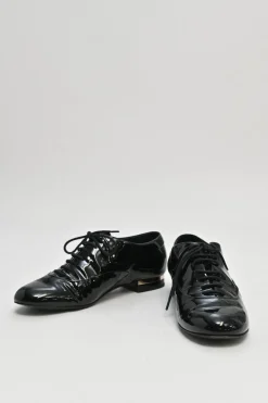 Black patent leather lace-up brogues with gold-tone metallic Coco Mark ankle and heel plaque