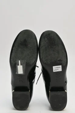 Black patent leather lace-up brogues with gold-tone metallic Coco Mark ankle and heel plaque